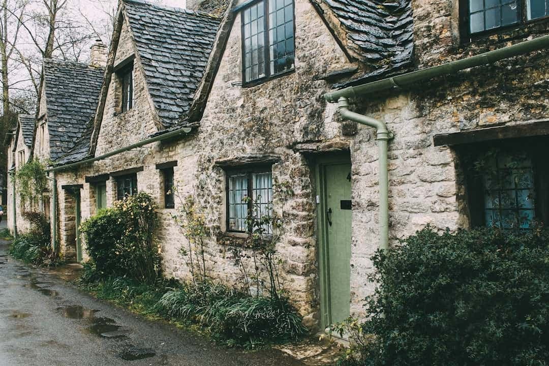 Row of old stone cottages along a quiet street