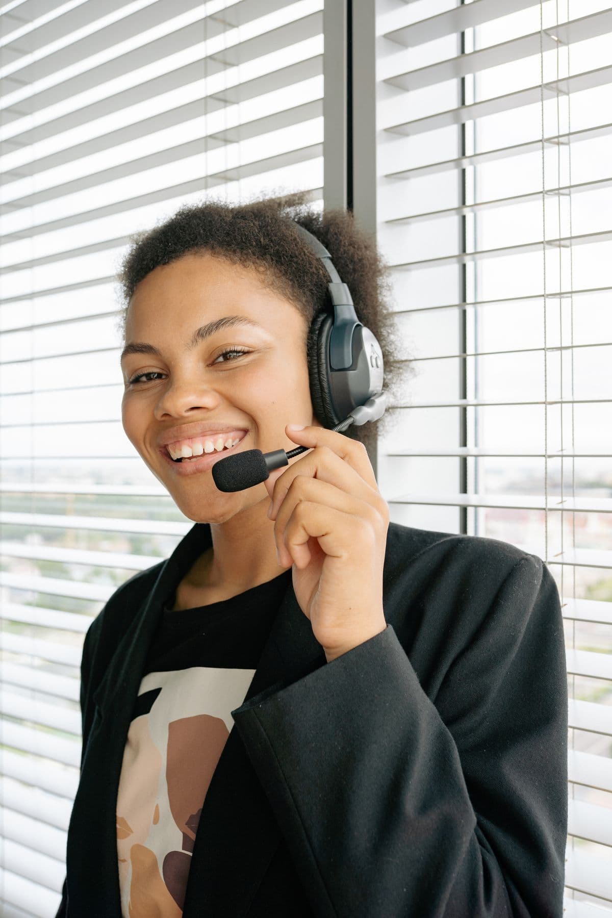 A friendly PRACPROS team member wearing a headset